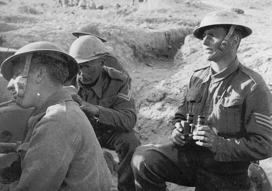 R-L Sgt Andrews, DCM; Cpl Brenton; another manning their 6 pdr gun.