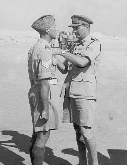 Major-General Erskine presenting the Military Medal to Sgt J. Stewart